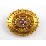 A Victorian 15 carat gold gem set brooch