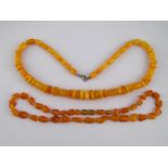 A mixed lot comprising two amber necklac