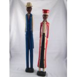 A pair of Colonial wooden figures , Ivory Coast , circa 1960, hts 55&60 cm.
