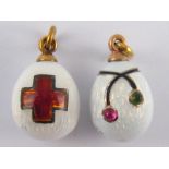 Two Russian guilloche enamelled eggs, one with Red Cross emblem, marked 56, approx 14 ct.