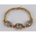 A 15 carat gold aquamarine and seed pearl expanding bracelet, largest stone approx 8.7 x 6.