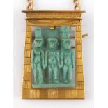 An Egyptian yellow metal (tests 18 carat gold) framed pendant with brooch fitting,