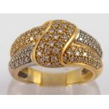 A yellow metal (tests 18 carat gold) diamond ring, estimated total diamond content 0.50ct. Size N,