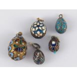 Five Russian cloisonne enamelled eggs; one Soviet silver mark 875, one Russian silver mark 84,