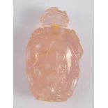 A Chinese rose quartz snuff bottle and stopper, carved in high relief with figures and foliage. Ht.