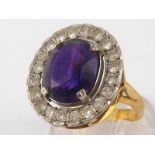 An 18 carat gold amethyst and diamond ring, amethyst approx 12.5 x 10.5mm, ring size Q, 7.3 gms.