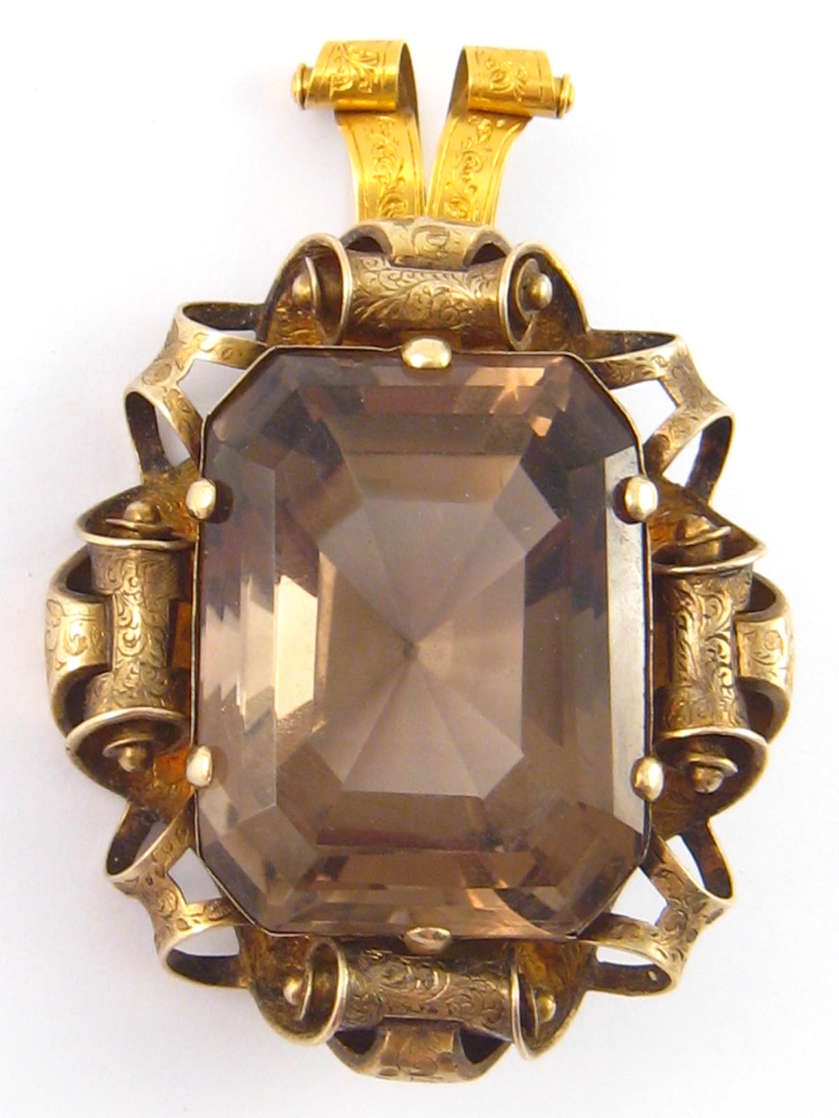 A large antique 15ct gold smoky quartz pendant, the stone measuring approx.