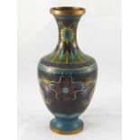 A cloisonne enamelled brass vase with dragons and flaming pearl (damaged). Ht. 27cm.