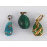 Three Russian miniature eggs, being one hardstone, maker and 84 silver mark, one ceramic, unmarked,