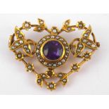 An antique 9 carat gold amethyst and seed pearl pendant with brooch fitting (untested pin),