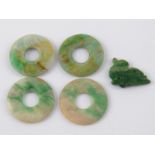 Four jade discs, each 2.5cm. diameter, together with a jade bird pendant.