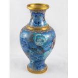 A baluster brass vase with fine cloisonne enamels of flora in shades of blue and brown. ht.20cm.