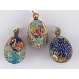 Three Russian cloisonne enamelled eggs, all with 84 standard silver marks.