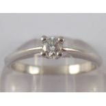 A white metal (tests 18 carat gold) diamond solitaire ring, size K, 2.3 gms.