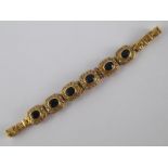 A yellow metal (tests 18 carat gold) sapphire and diamond bracelet, approx 18cm long,