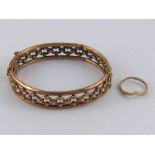 A mixed lot comprising a 9 carat gold bangle and a 9 carat gold ring, gross weight 13.5 gms.