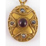 An antique 9 carat gold gem set locket back pendant, approx 2.5cm, 3.5 gms.