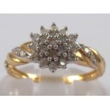 A 9 carat gold diamond cluster ring, estimated diamond content approx 0.25 carat, ring size M ½, 1.