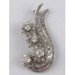 An 18 carat white gold (tested) diamond brooch,