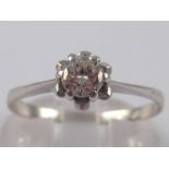 An 18 carat gold diamond solitaire ring,