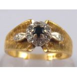 An 18 carat gold sapphire and diamond ring, size M, 4.4 gms.