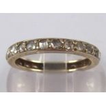 A white metal (tests 18 carat gold) rose cut diamond eternity ring, approx 2.