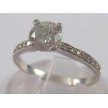 A white metal (tests 14 carat gold) diamond ring,