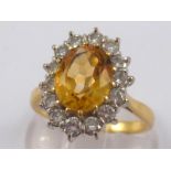 An 18 carat gold citrine and diamond ring, citrine approx 10 x 8mm,