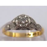 A yellow and white metal diamond solitaire ring, marked 18ct plat, size J, 2.3 gms.