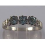 A 9 carat white gold blue topaz and diamond ring, size U, 2.8 gms.