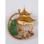 A Chinese yellow metal (tests 18 carat gold) brooch with pendant fitting,