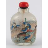 A Chinese glass snuff bottle internally painted with warriors, red stopper with spoon, cork missing.