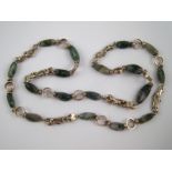 A silver and moss agate necklace, approx 80cm long, circa 1980.