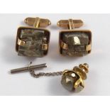 A pair of 9 carat gold cufflinks, set with pyrite, with a matching unmarked yellow metal tie pin.