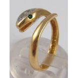 A yellow metal (tests 14 carat gold) diamond set snake ring, size O, 3.1 gms.