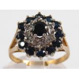 A 9 carat gold sapphire and diamond ring, size T, 4.6 gms.