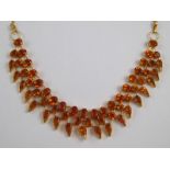 A yellow metal (tests high carat gold) citrine fringe necklace, stamped 916, approx 35cm long,