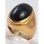 A French hallmarked 18 carat gold cabochon sapphire ring, the stone measuring approx. 19.