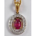 An 18 carat gold ruby and diamond pendant, the ruby of fine colour measuring approx 6 x 4mm,