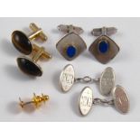 A mixed lot comprising a pair of silver cufflinks, a pair of cufflinks marked sterling,