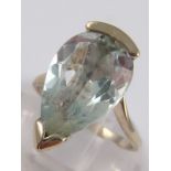 A white metal (tests 18 carat gold) pear shape aquamarine ring, aquamarine approx.