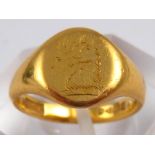 A 22 carat gold signet ring, size I ½,