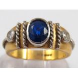 An 18 carat gold sapphire and diamond ring, the sapphire of good colour measuring approx 6.