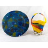 A studio glass plate, the blue body inset with random fragments of coloured glass,