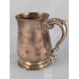 A George III silver baluster mug with leaf capped double scroll handle, Walter Brind, London, 1785.