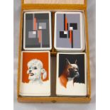 A double canasta card box with two canasta packs, one unopened, one with fourth joker missing,