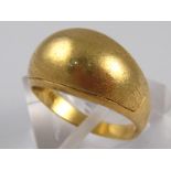 A yellow metal (tests 18 carat gold) ring, size N, 3.2 gms.