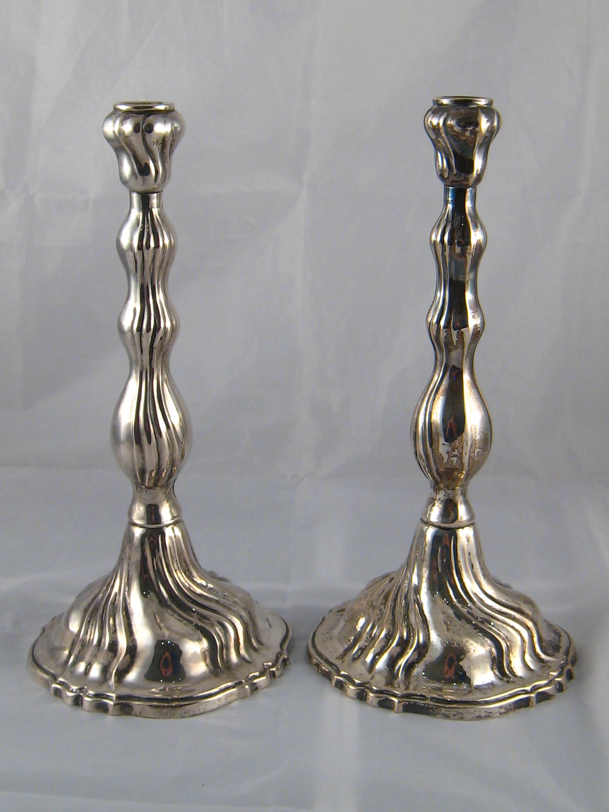 A pair of Israeli silver, marked 800, Shabat candlesticks, ht. 30cm. , wt. 494gm.