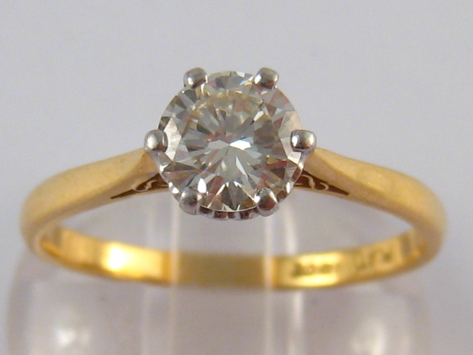 A yellow metal (tests 18 carat gold) diamond solitaire ring,