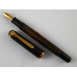 A Pelikan M-400 fountain pen, Made in West Germany with 14 carat gold nib.